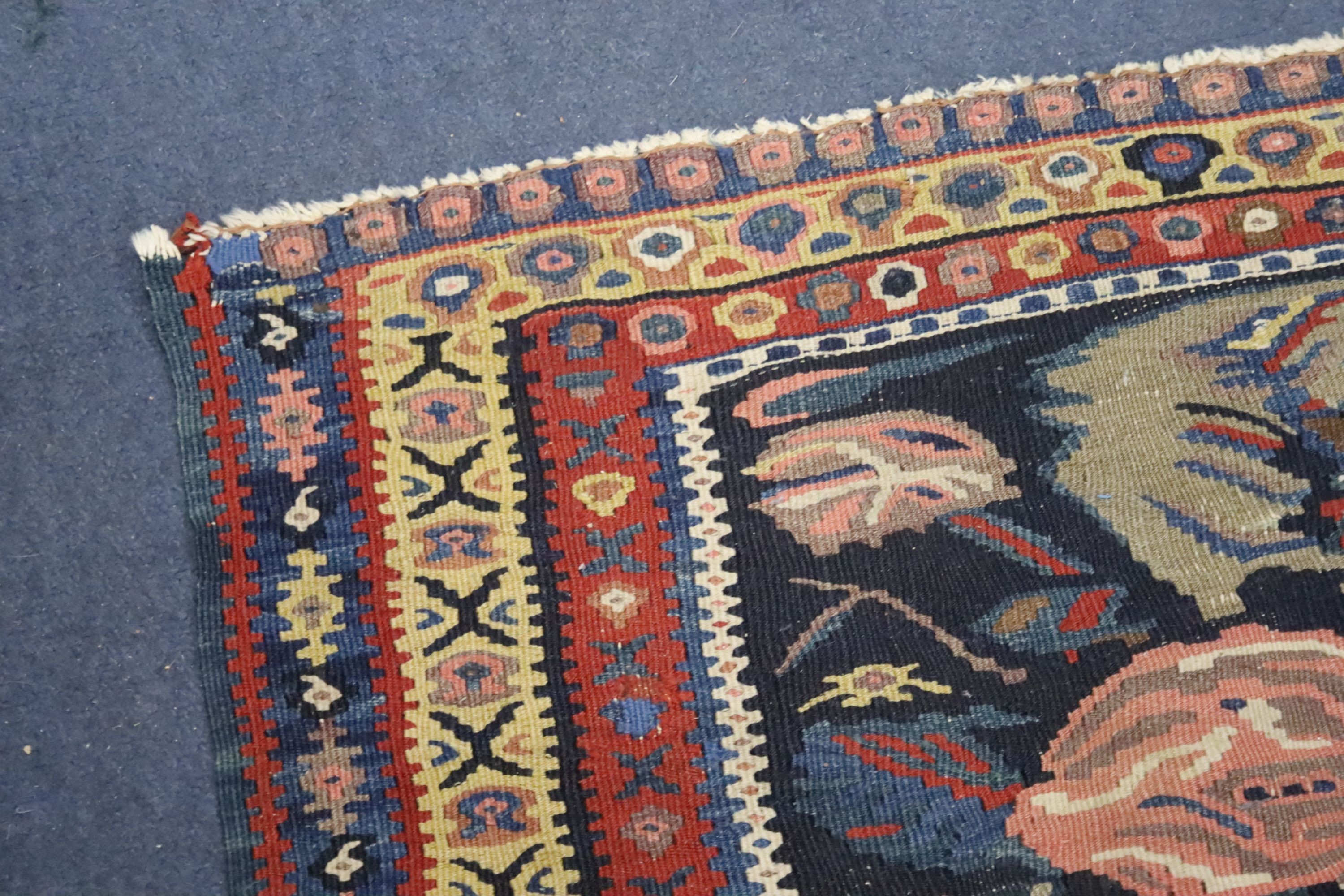 A late 19th century / early 20th century Senneh polychrome Kilim rug, 190 x 130cm